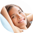 woman relaxed on couch smiling